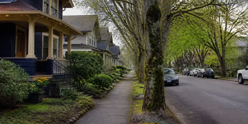 Tree-lined residential street with Craftsman homes in inner Northeast Portland, Oregon