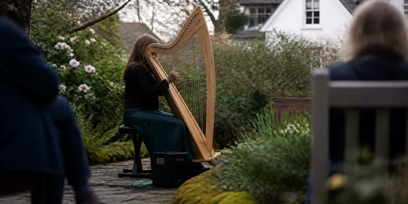 Harpist performing in garden setting Lents SE Portland Oregon