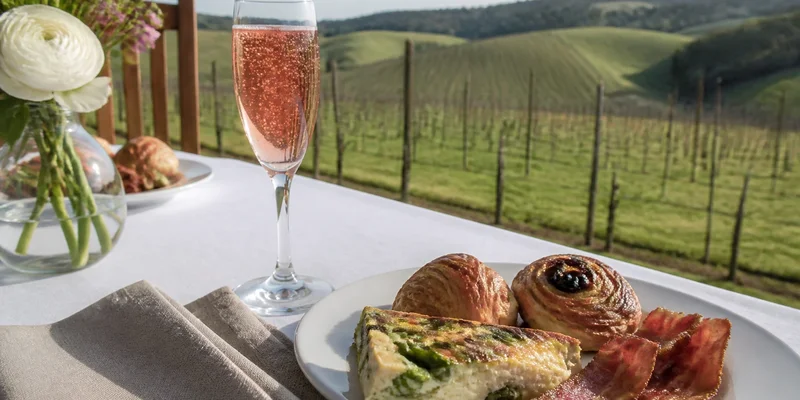 Vineyard brunch table with Willamette Valley views and sparkling rose Salem Oregon wine country