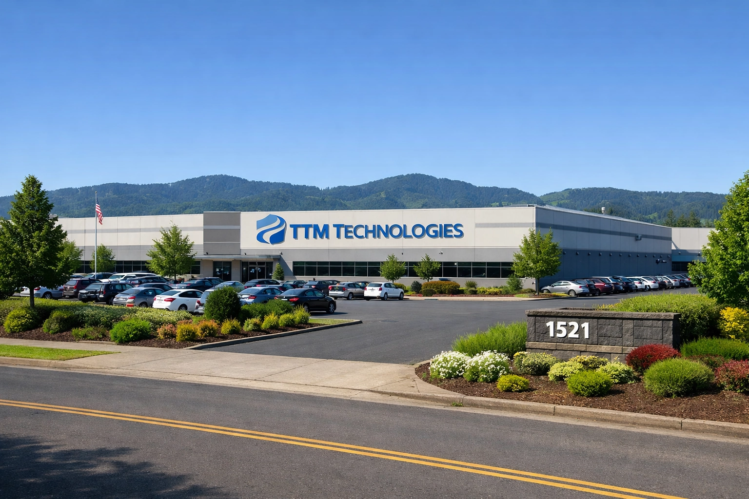 Commercial building entrance with a technology company sign visible on a landscaped office campus
